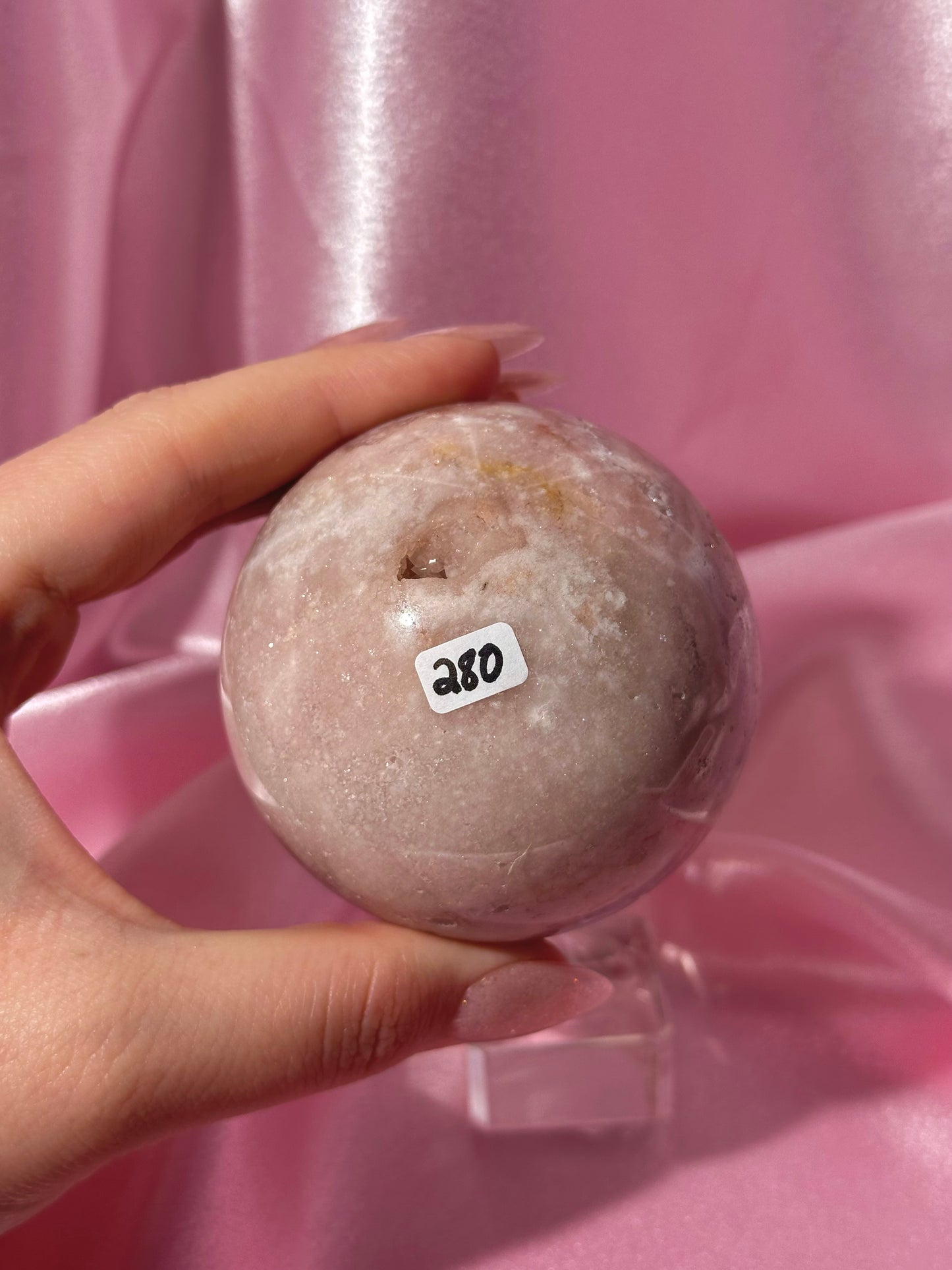 Brazilian pink amethyst sphere with purple druzy cave