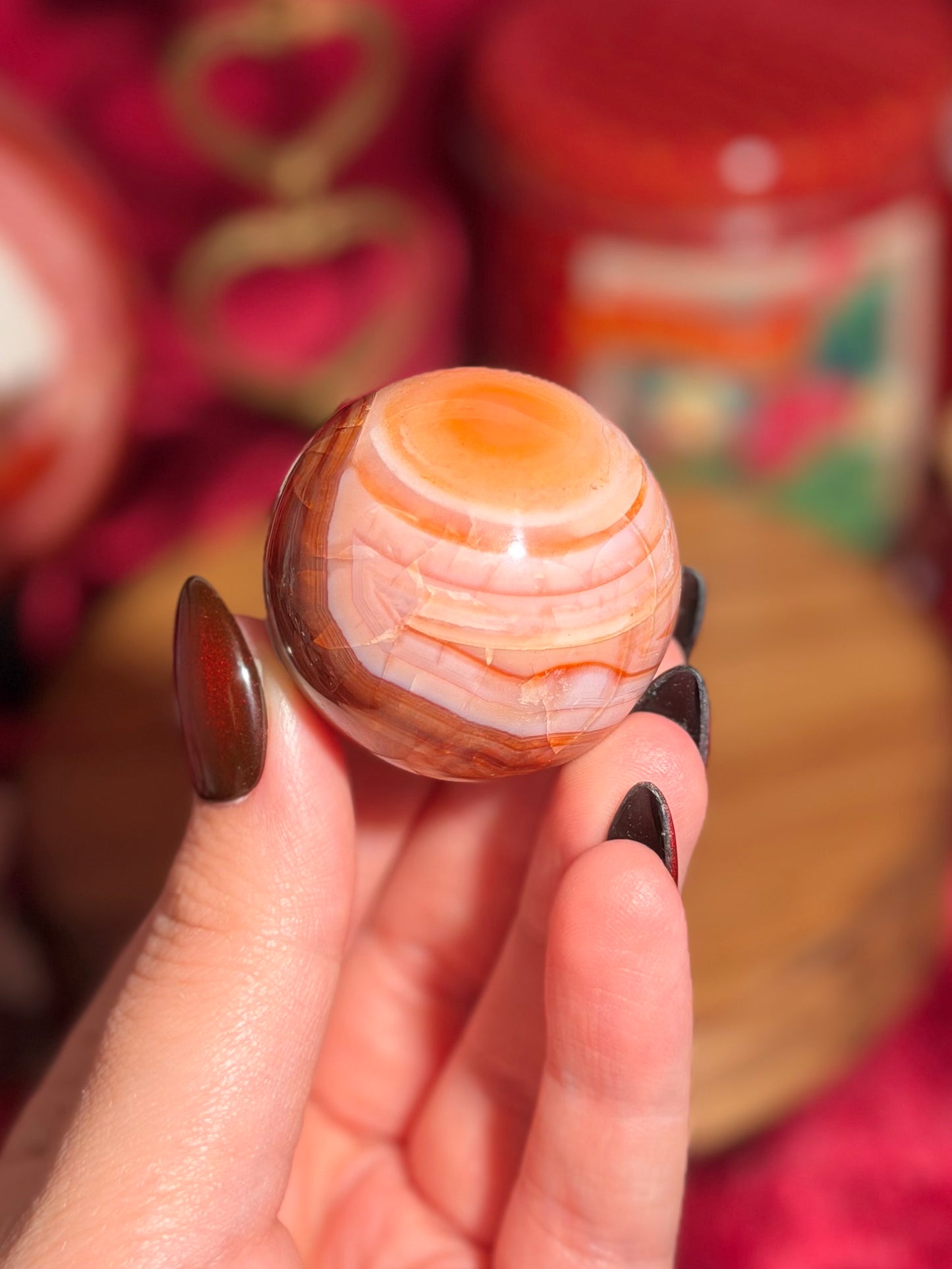 Peachy pink carnelian sphere
