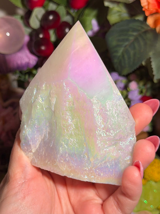 Aura coated rose quartz half polished point from Brazil