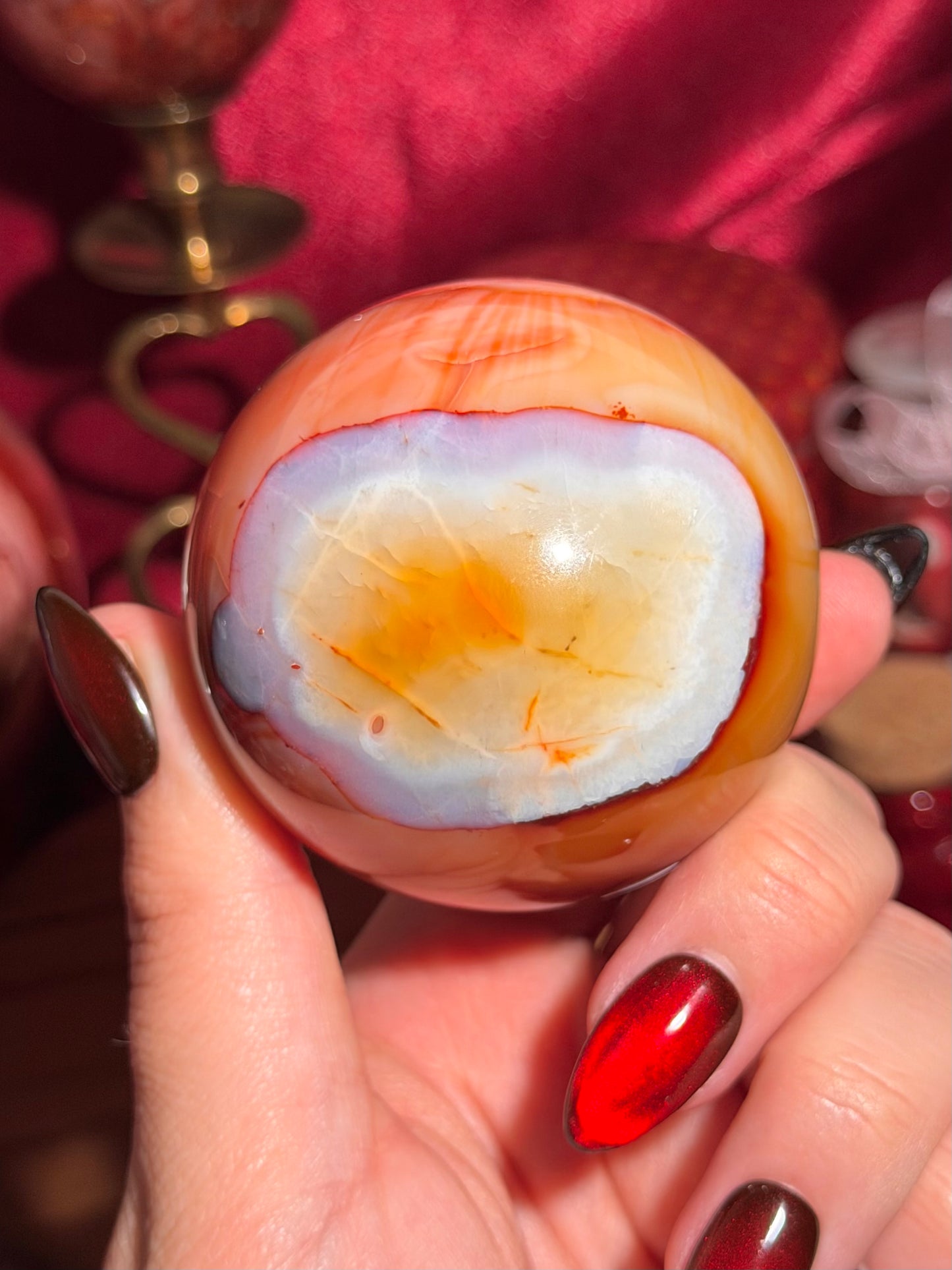 Rainbow banded carnelian sphere 65mm