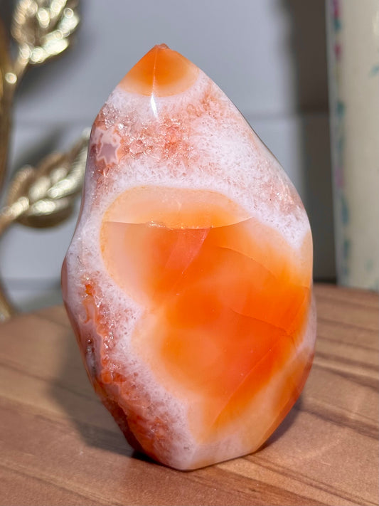 Peachy carnelian flame with quartz and natural caves