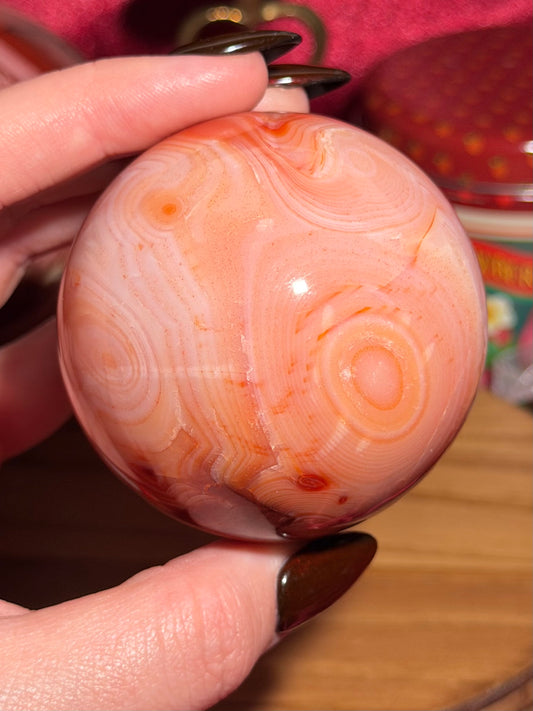 Pink banded carnelian sphere