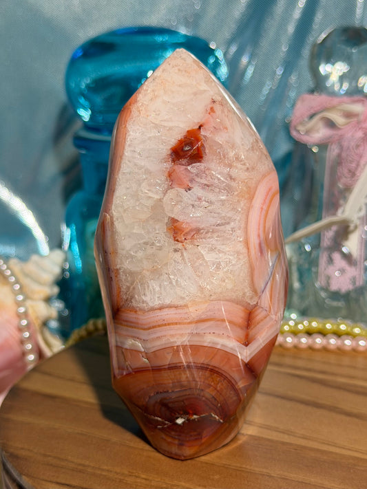 Large pink banded carnelian flame with quartz
