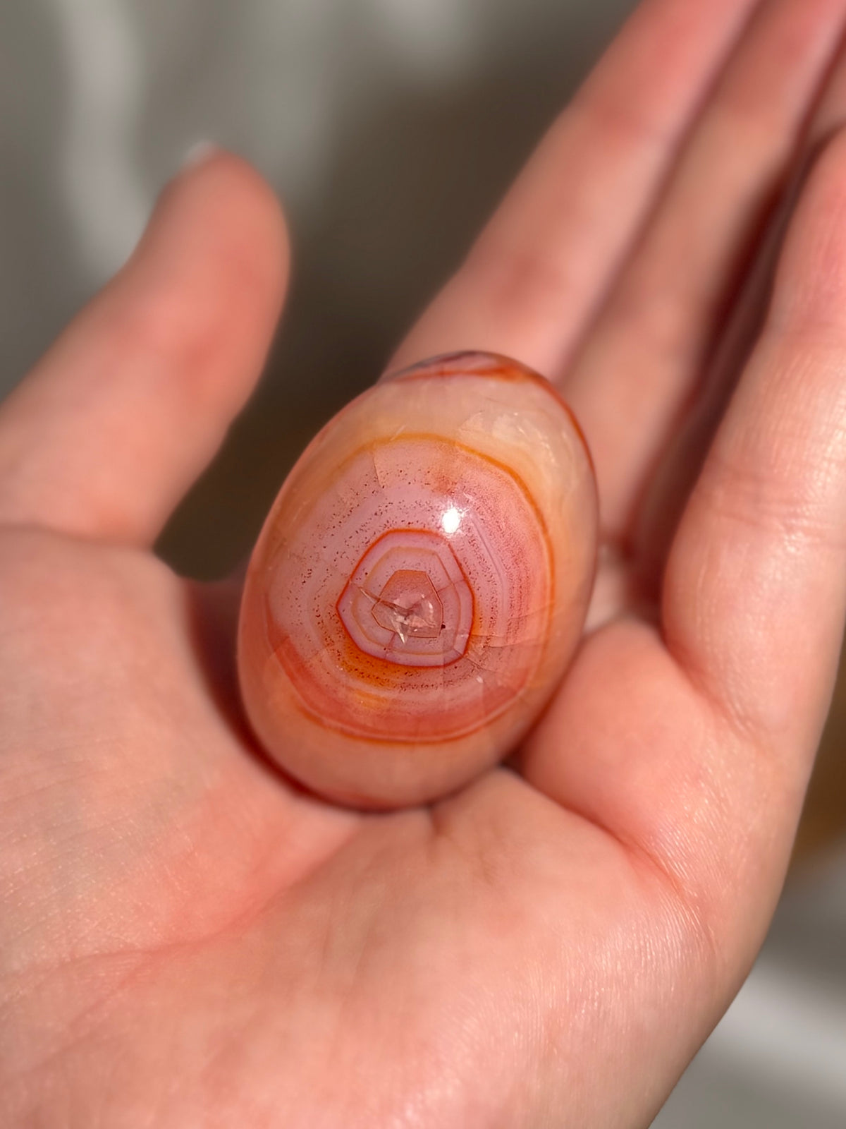 Pink banded carnelian palmstone