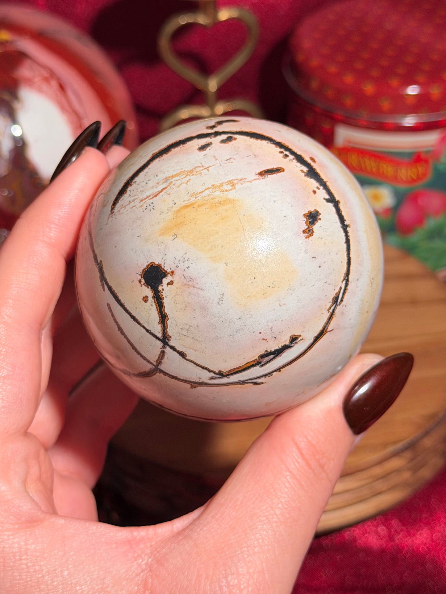 Pink and yellow Chinese picture jasper sphere with unique patterns