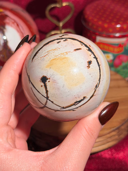 Pink and yellow Chinese picture jasper sphere with unique patterns