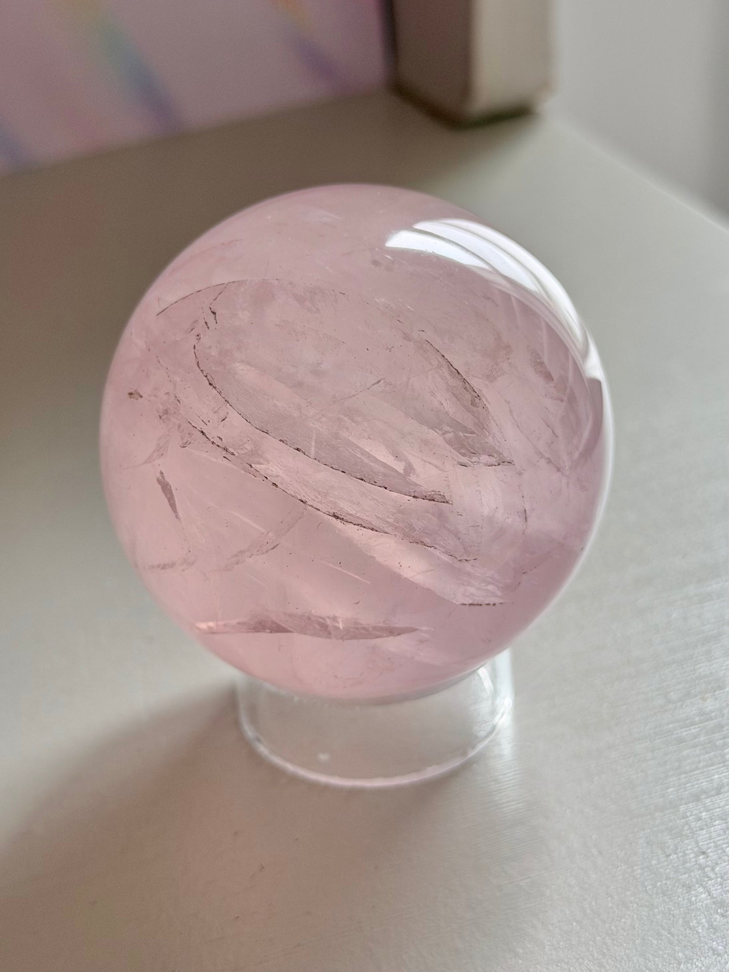 Pale pink gemmy star rose quartz sphere