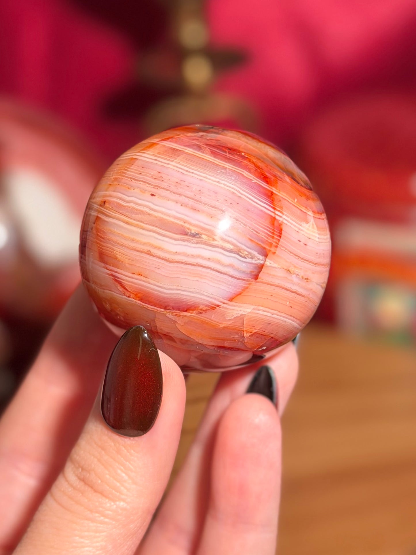 Pink banded carnelian sphere