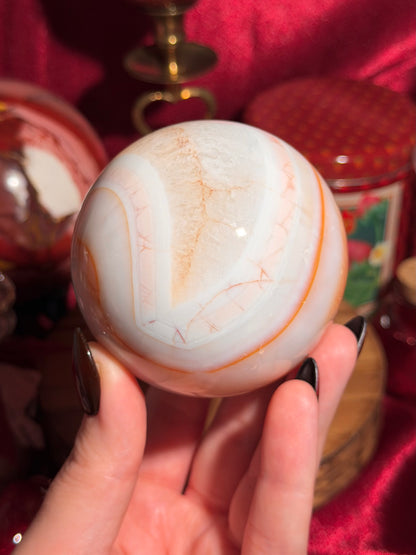Pastel cool toned pink carnelian sphere with quartz 75mm