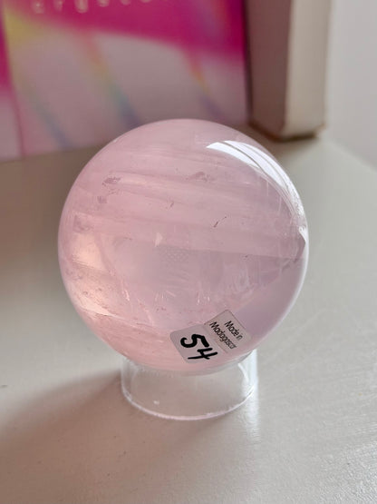 Pale pink gemmy star rose quartz sphere