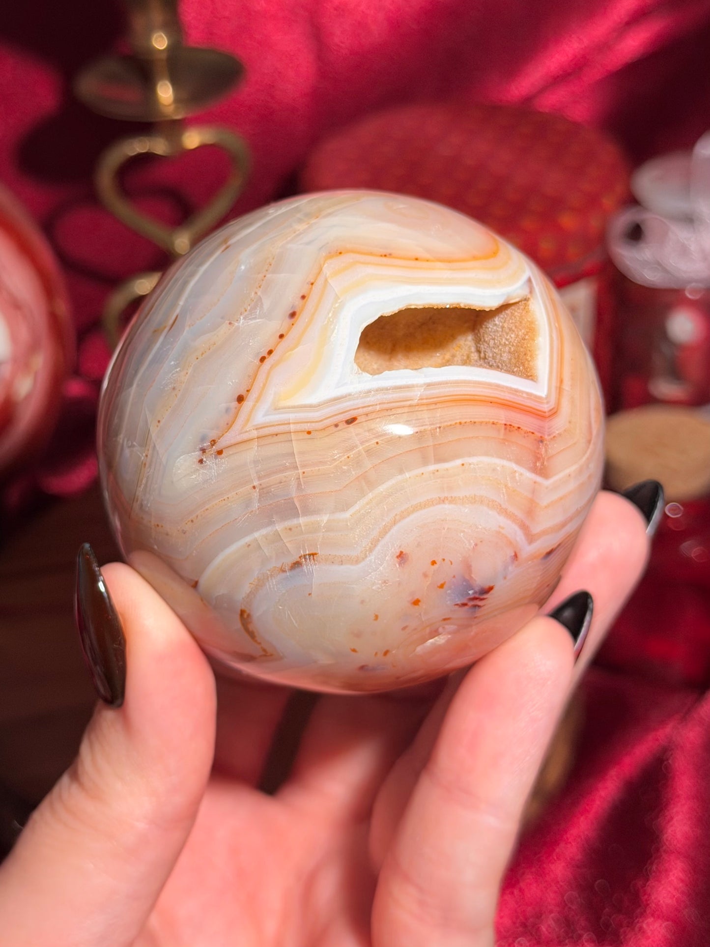 Pastel yellow and peachy toned carnelian sphere with large druzy cave 72mm