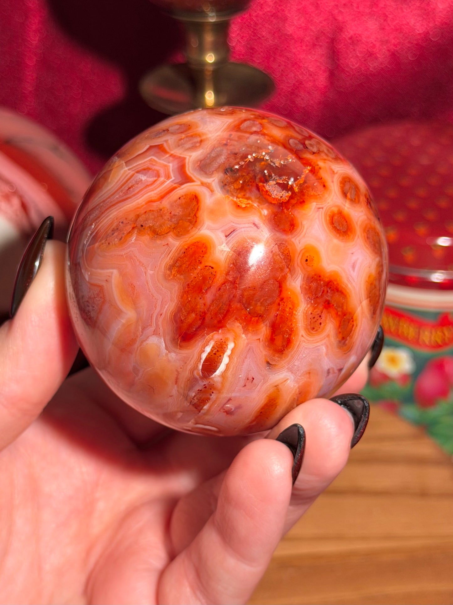Mossy carnelian sphere with quartz cave
