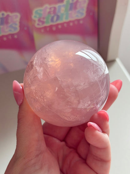 Gemmy purple-pink toned star rose quartz sphere