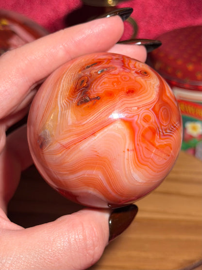 Pink banded carnelian sphere