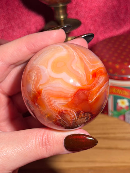 Funky banded carnelian sphere with moss inclusions