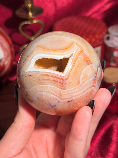 Pastel yellow and peachy toned carnelian sphere with large druzy cave 72mm