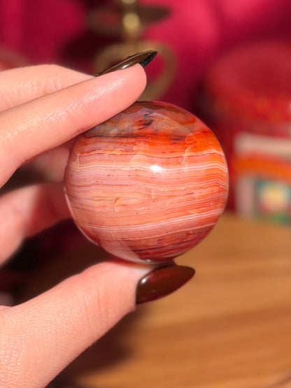 Pink banded carnelian sphere
