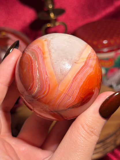 Rainbow carnelian sphere with quartz