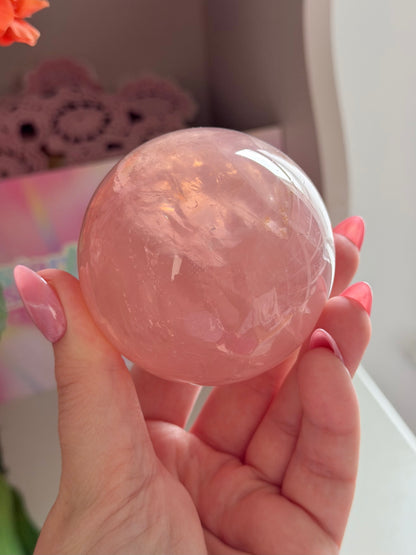 Juicy pink star rose quartz sphere with rainbows