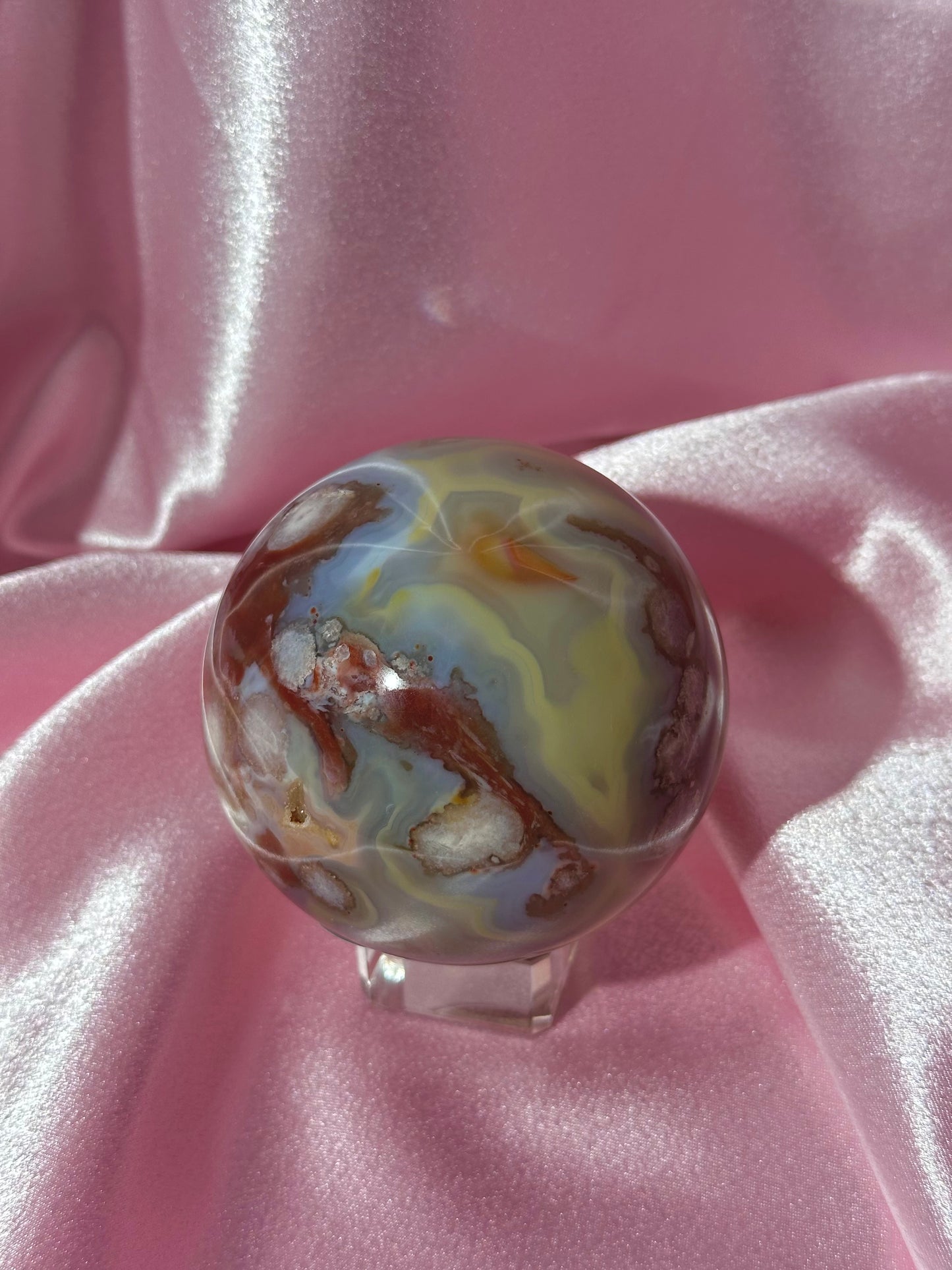 Perfect pastel peachy yellow & blue flower agate sphere from Madagascar