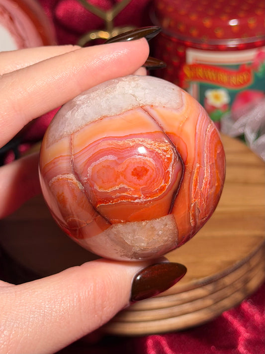 Rainbow carnelian sphere with quartz