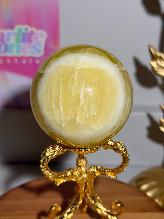 Lemon calcite sphere from Pakistan with rainbows