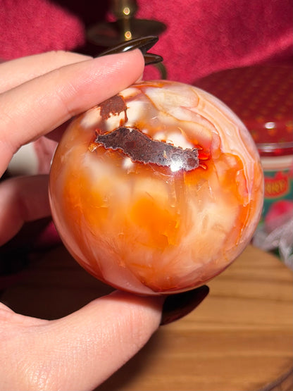 Glowy yellow carnelian sphere with imperfect fill spots