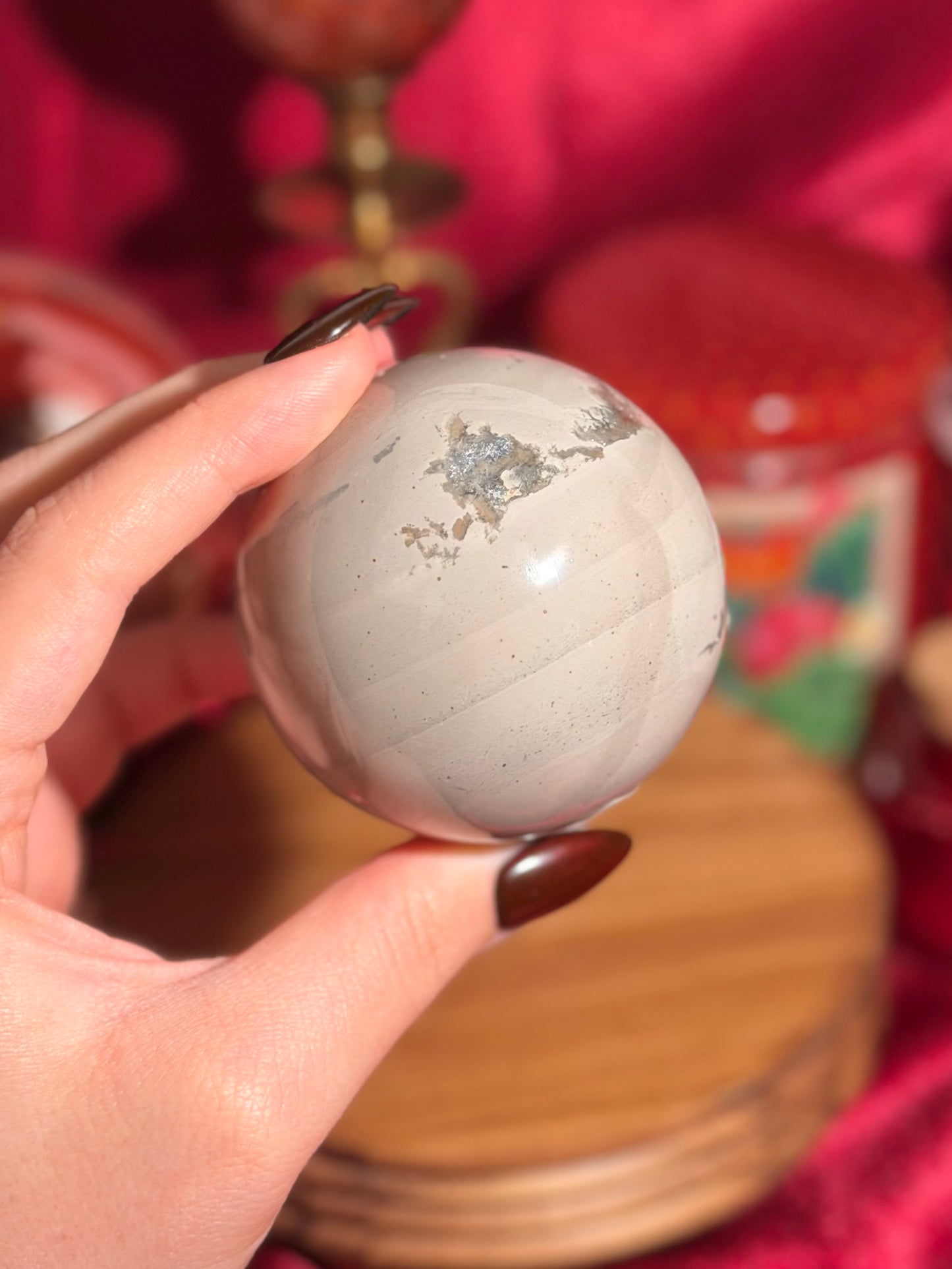 Cool grey polychrome jasper sphere with a pop of pink
