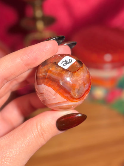 Peachy pink carnelian sphere