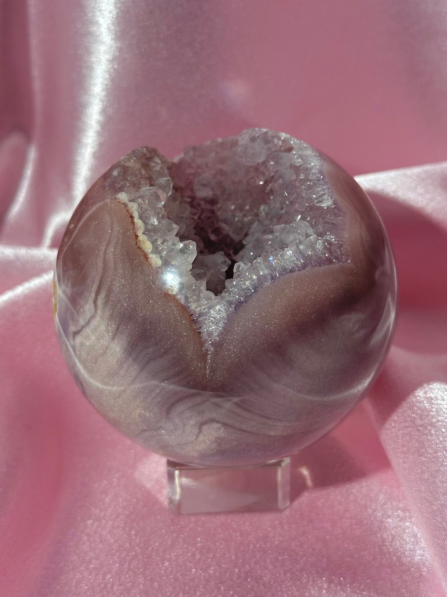 Lavender-toned glittery Brazilian pink amethyst sphere with stunning quartz cave