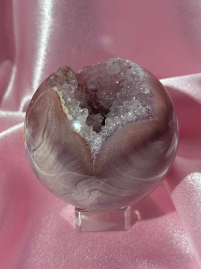 Lavender-toned glittery Brazilian pink amethyst sphere with stunning quartz cave