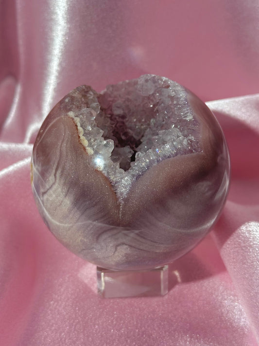 Lavender-toned glittery Brazilian pink amethyst sphere with stunning quartz cave