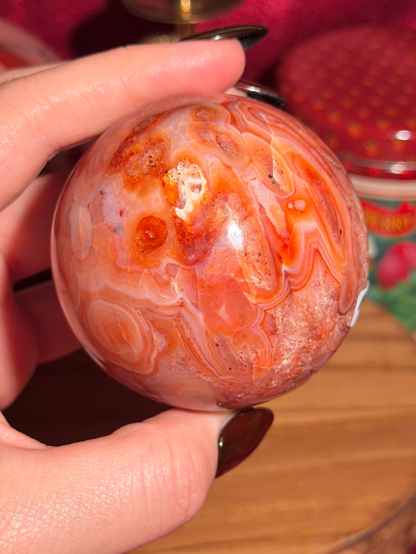 Mossy carnelian sphere with quartz cave