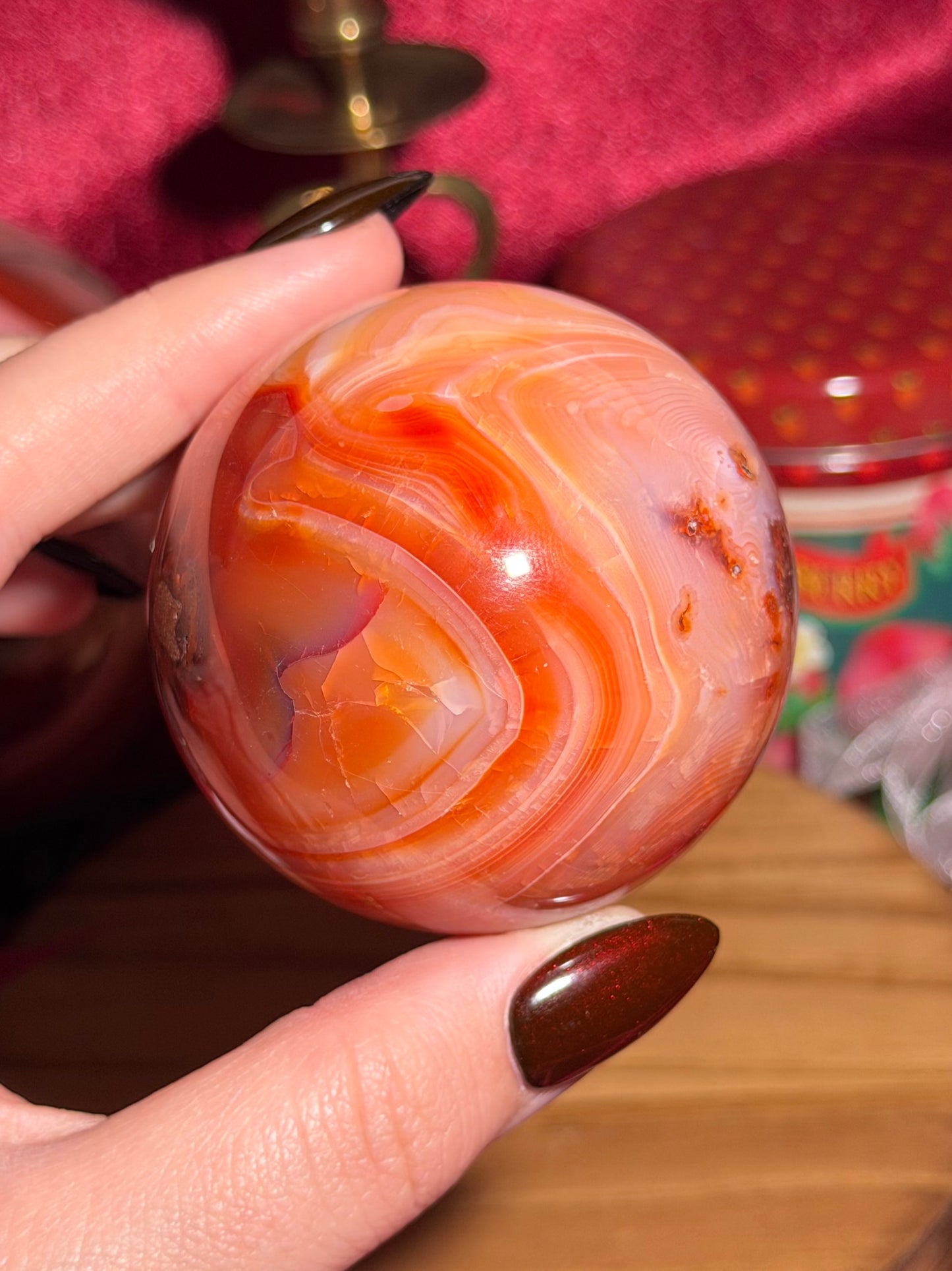 Funky banded carnelian sphere with moss inclusions