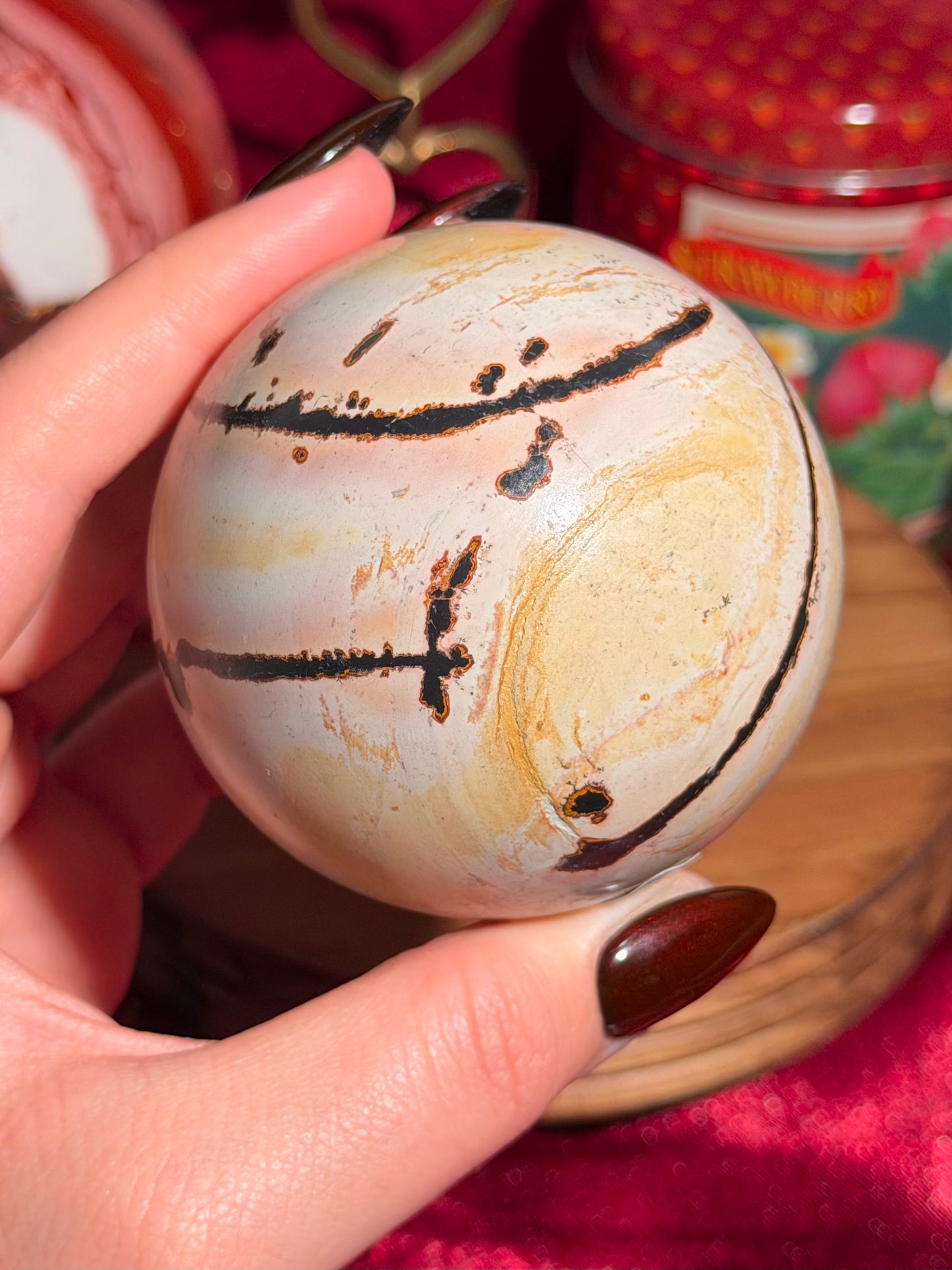 Pink and yellow Chinese picture jasper sphere with unique patterns