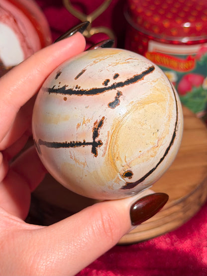 Pink and yellow Chinese picture jasper sphere with unique patterns