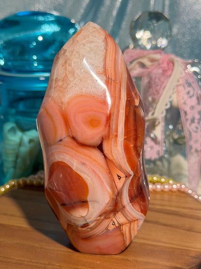 Large pink banded carnelian flame with quartz