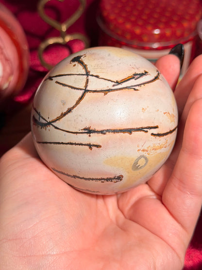 Pink and yellow Chinese picture jasper sphere with unique patterns