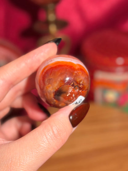 Peachy pink carnelian sphere