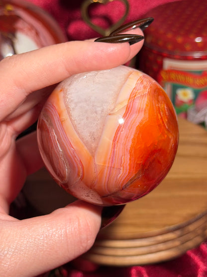 Rainbow carnelian sphere with quartz