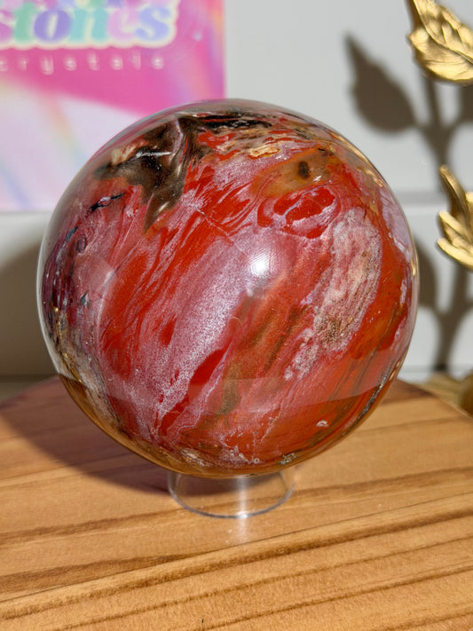 Vampy red and black petrified wood sphere from Madagascar