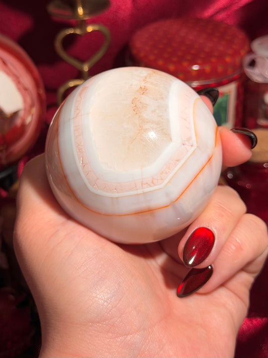 Pastel cool toned pink carnelian sphere with quartz 75mm