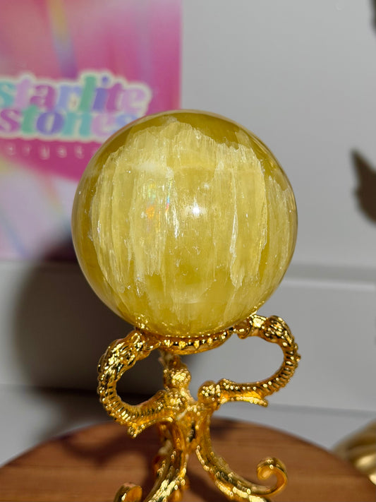Lemon calcite sphere from Pakistan with rainbows