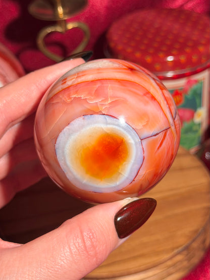 Rainbow banded carnelian sphere 65mm