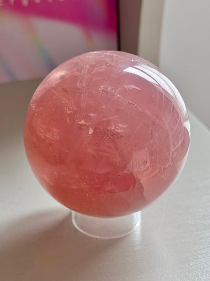 Juicy pink star rose quartz sphere with rainbows