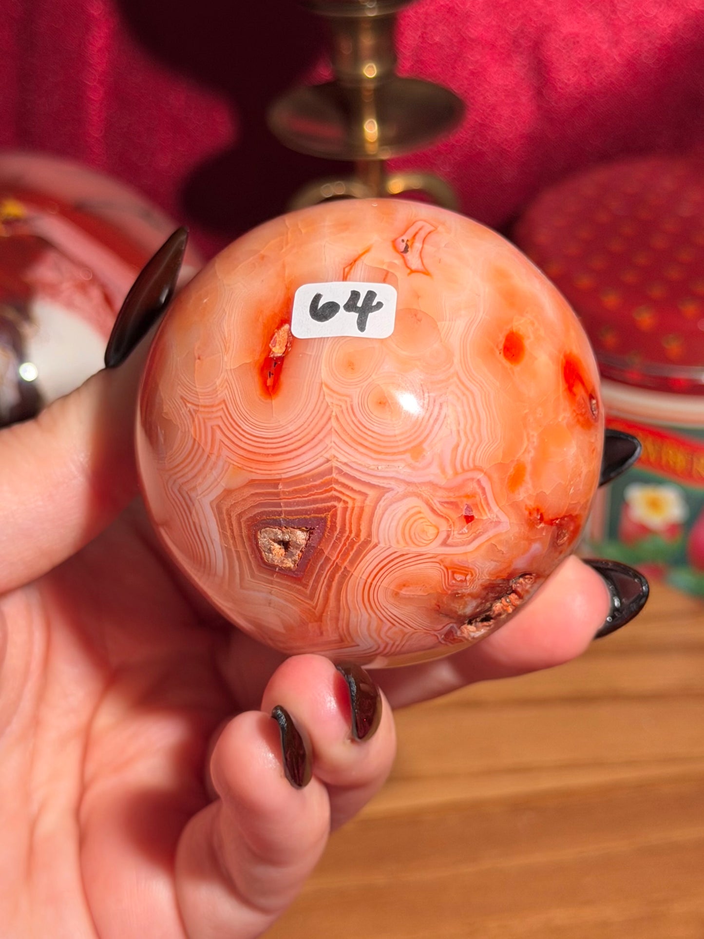 Peachy pink carnelian sphere with adorable scalloped banding