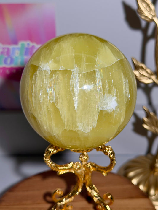 Lemon calcite sphere from Pakistan with rainbows