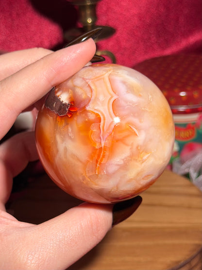 Glowy yellow carnelian sphere with imperfect fill spots