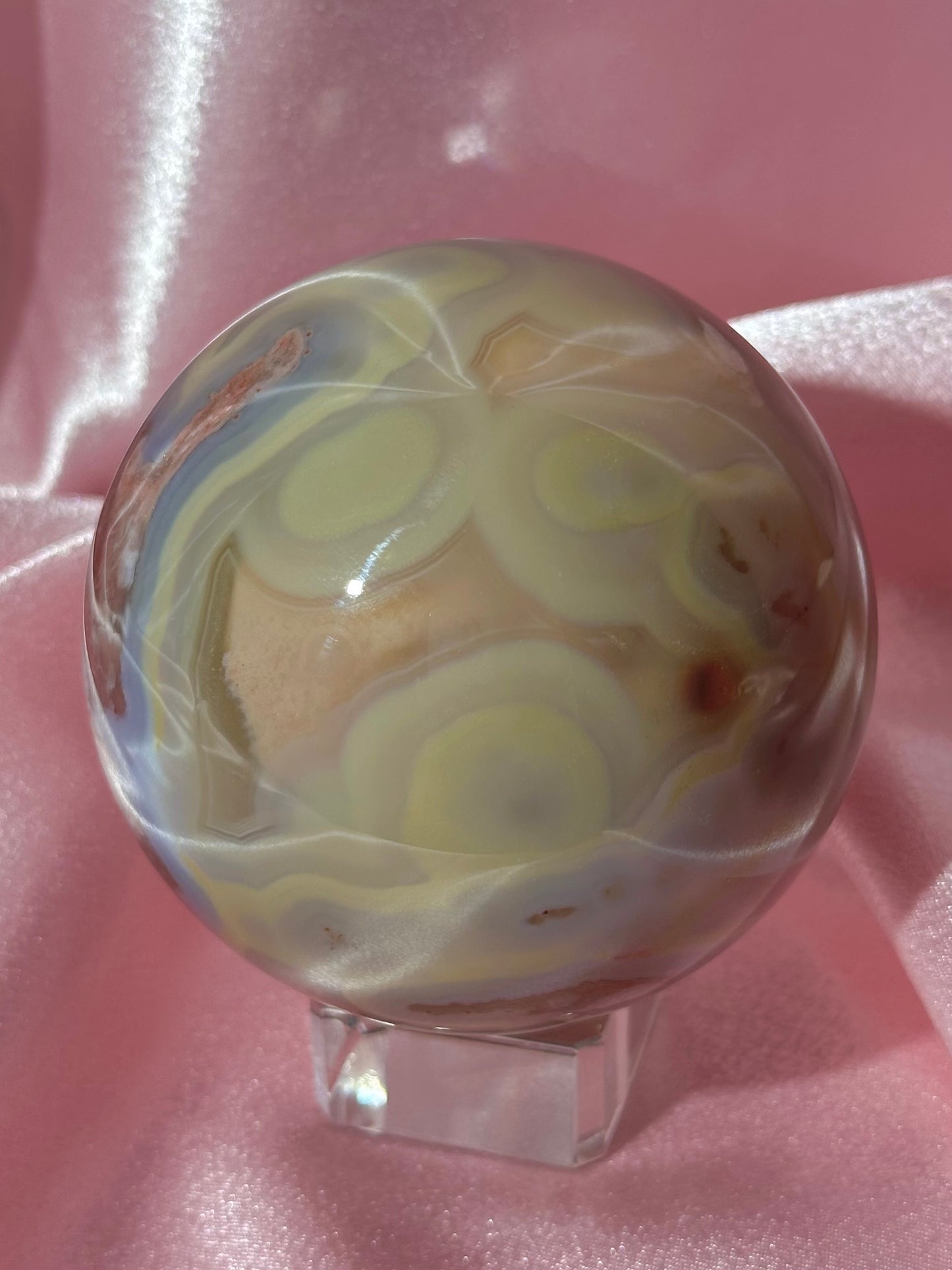 Perfect pastel peachy yellow & blue flower agate sphere from Madagascar