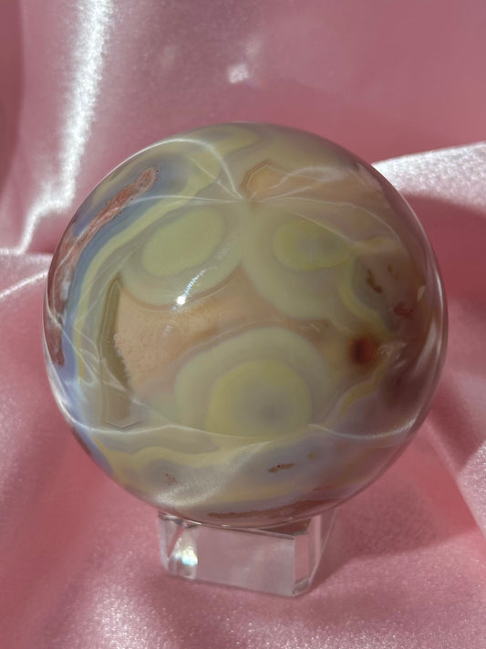 Perfect pastel peachy yellow & blue flower agate sphere from Madagascar